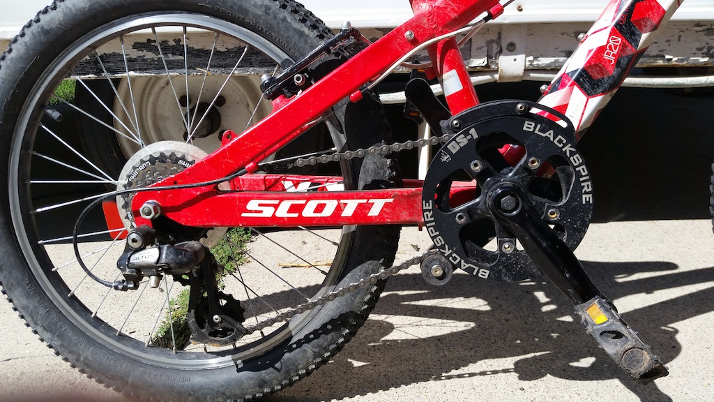 KP at Salt Cycles in Sandy , UT modified the crap out of the boys' bikes. Put a Black Spire chain grabber on both. This is the 20" Scott Voltage.