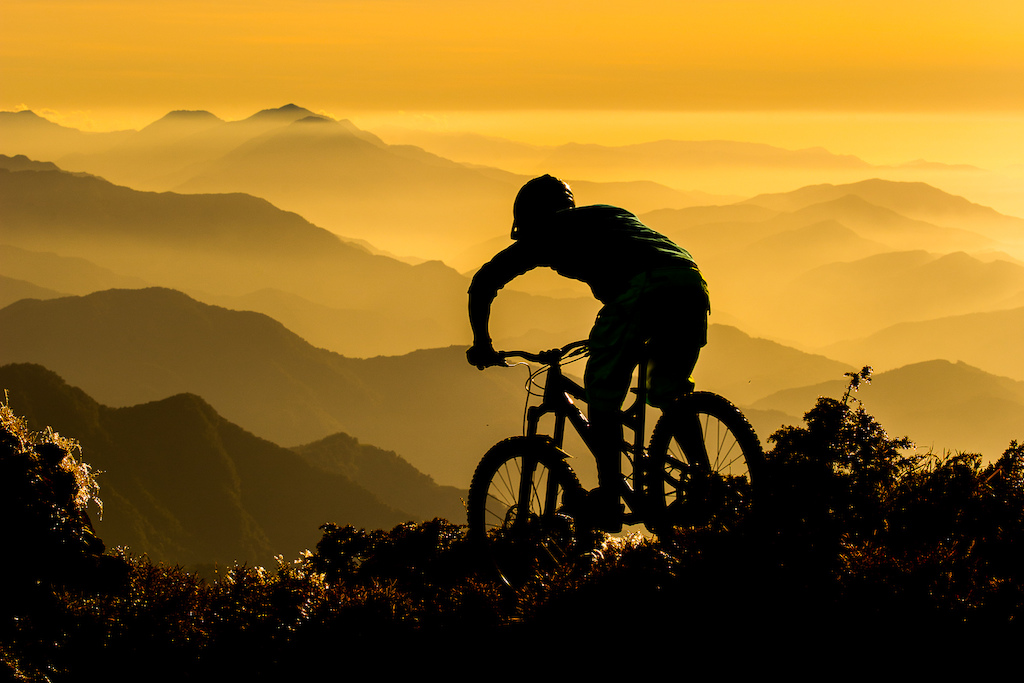 I shot this earlier in the day when the mountains were a deep blue, but came back later as the sun was setting. Over my right shoulder is Taichung, where your bike is probably made.  A vertical crop of this was later used for a cover shot.