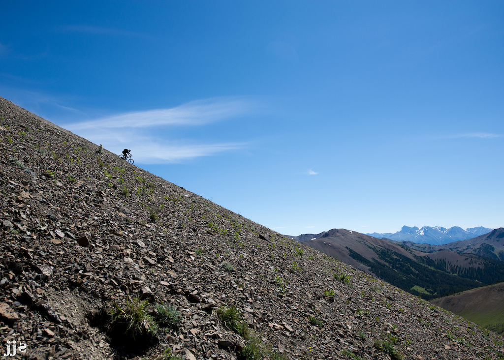 Riding a shale slope in the Windy Pass in the Chilcotins, BC