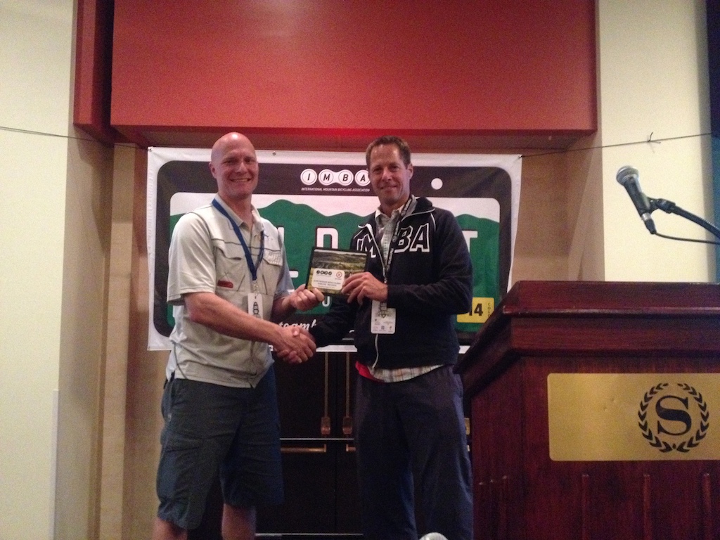 Cam accepting the plaque for Silver Ride Centre Status from Mark Eller, communications director for IMBA USA.