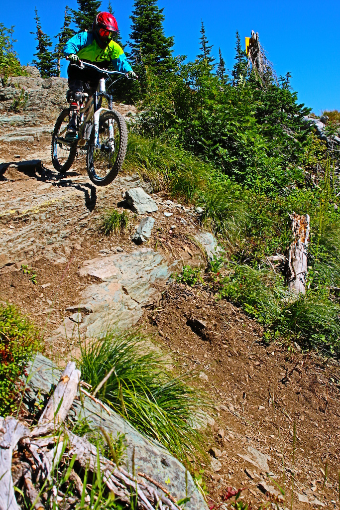Andre dropping over the rocks on one of the most challenging course's at the resort.
