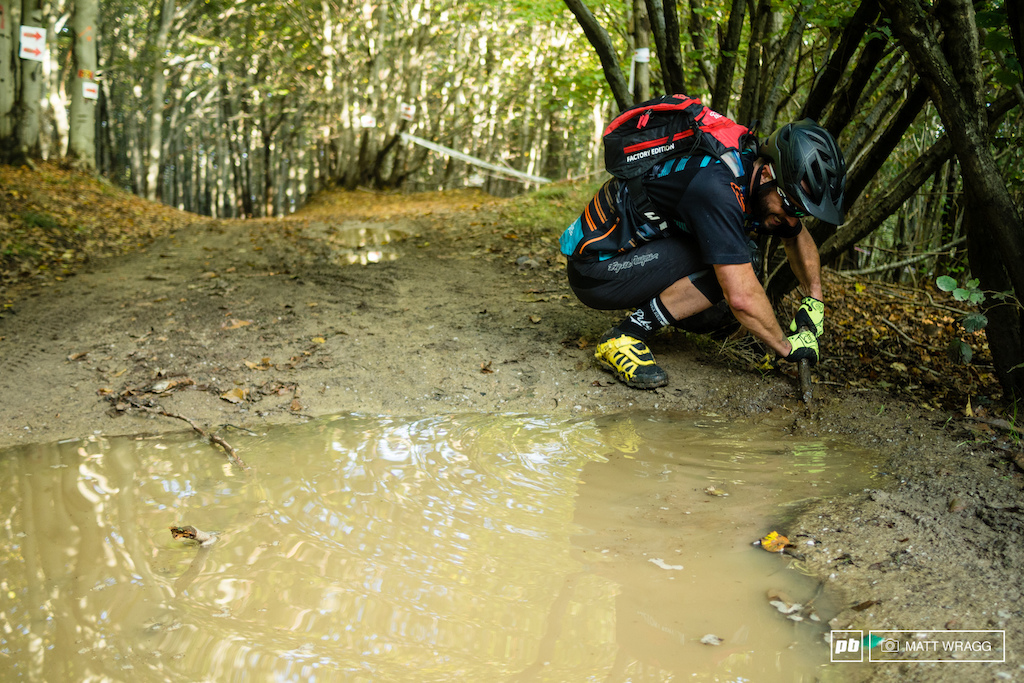 You have to earn your turns on the media recce ride - Matt Delorme getting down and dirty to drain a deep puddle on the upper part of stage five.