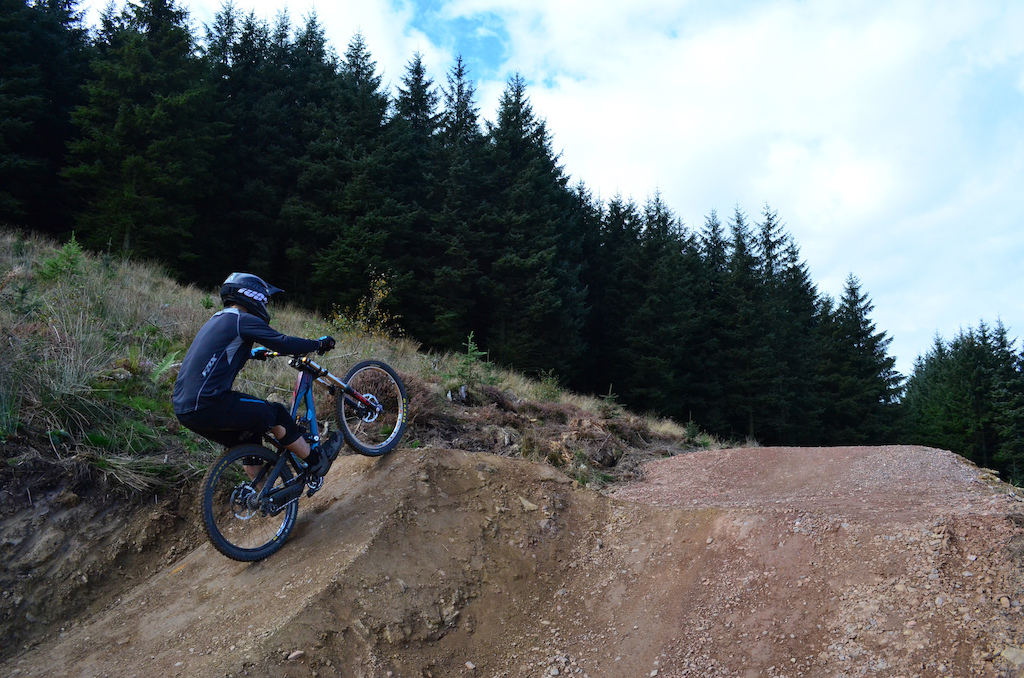 Hitting the step up on the awesome new A420 trail at Bike Park Wales.