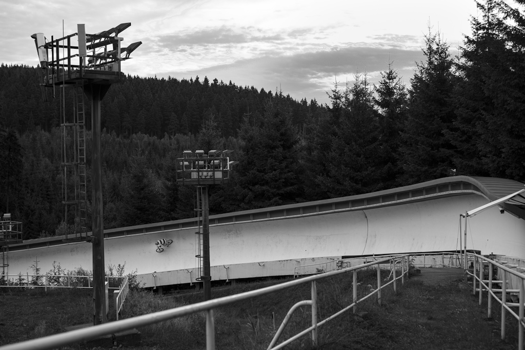 photographer/rider: Erik Hölperl

riding this particular Bobsledtrack was a dream of mine for a very long time so when my semesterholiday began this was the first thing we did. We drove there in the night and parked  very close and slept in the car. We got up before sunrise just to find that it rained over night. It was also my first time being on a bike since about two month because I injured my wrist. So I was nervous. Hopping fences to ride a wet forbidden and dangerous track with exactly zero warmup isnt really the smartest thing but it turned out fine. The feeling and sound of the screaming backtire sliding in the oververt was one of the radest expiriences I ever had on two wheel.