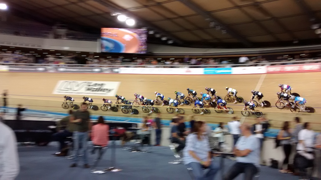 riders blasting around the velodrome