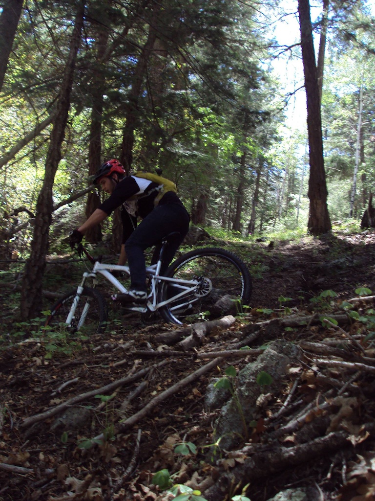 Exiting out of a loamy turn before dropping back into the gnar.