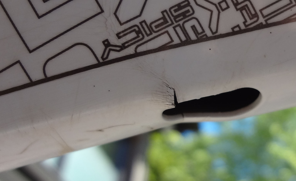 Broken Frame. Dented and cracked on the top tube around the first internal cable entry.