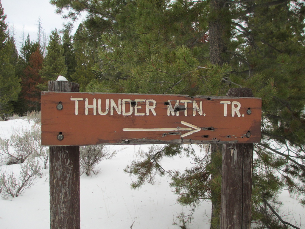 Trail sign on access road at upper trailhead.