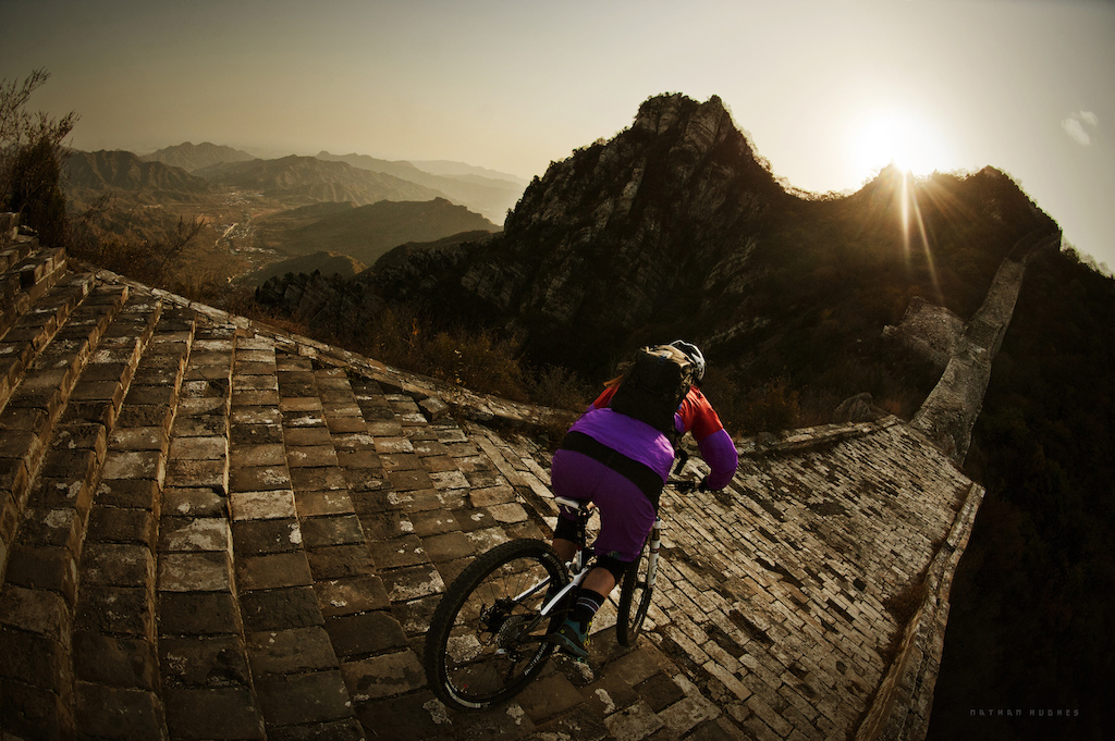 Steffi Marth rides the Great Wall of China outside Beijing on a Trek photo project. Copyright: Nathan Hughes