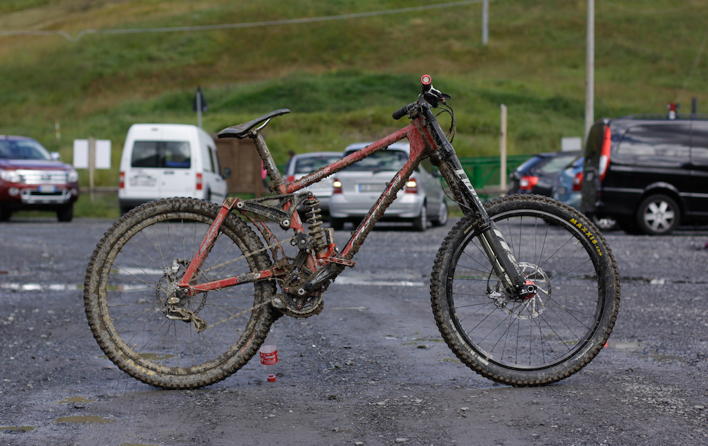 My K9 after a muddy day in Livingo (Mottolino Bikepark)

Partlist:
Frame: K9 DH001-S "L"
Shock: BOS S**Toy 400Lbs K9 Spring with Shockbearing
Fork: Manitou Dorado Pro 2012
Wheels: Hope Pro II Hubs, Sapim CX-Ray Spokes, H+Son Todestrieb Rims
Tires/Tubes: Maxxis Minion R/F 2.5m Schwalbe Ultralight Tubes
Shifting/Pedaling: Saint Rear Derailleur, XT Shifter, Dura-Ace Chain, e13 Chainring, Holzfeller Cranks, Twenty6 Rallye Pedals
Bar: RF Atlas Stealth
Brakes: Avid Code 185/203

Fastest and most silent bike I´ve ever ridden