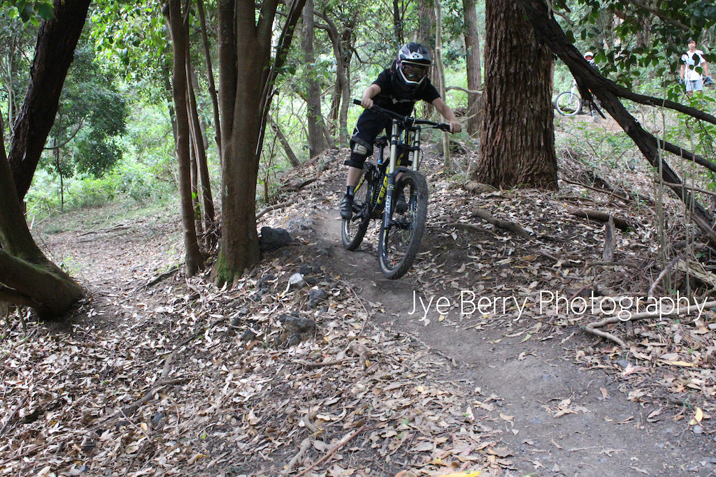 Angus tearing through the last berm before step up o Dirt Circus, Mt Keira.