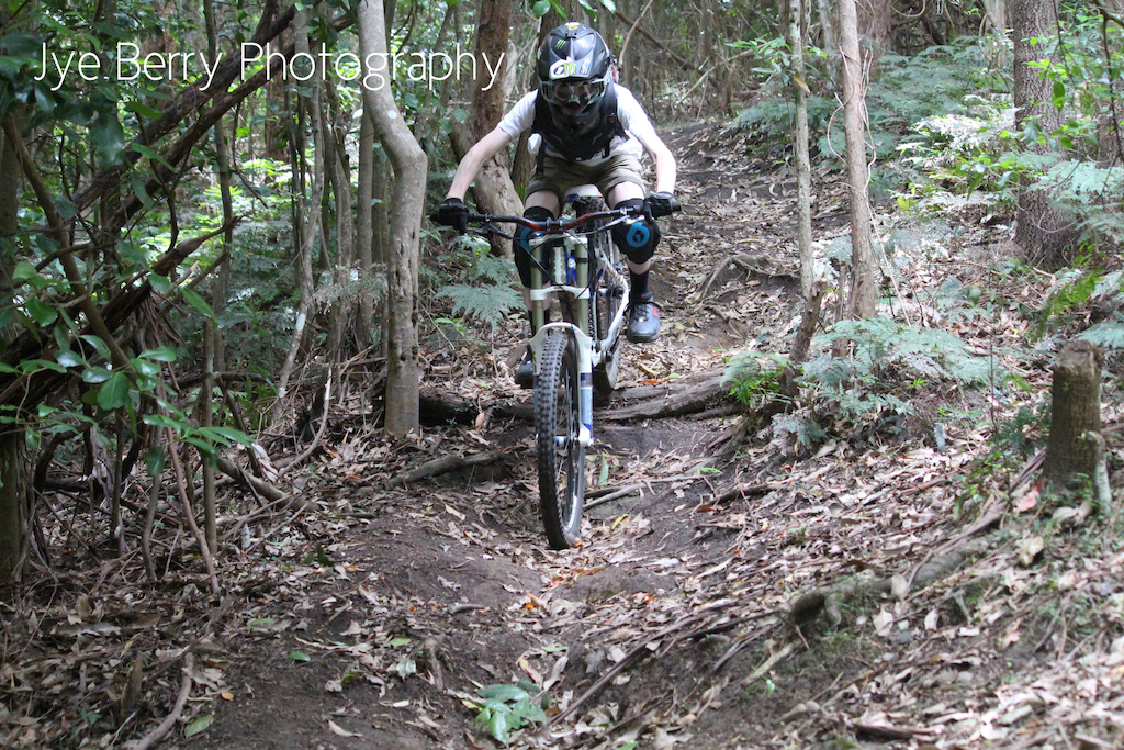 Toby coming through the little log drop on Greg's at Mt Keira.
