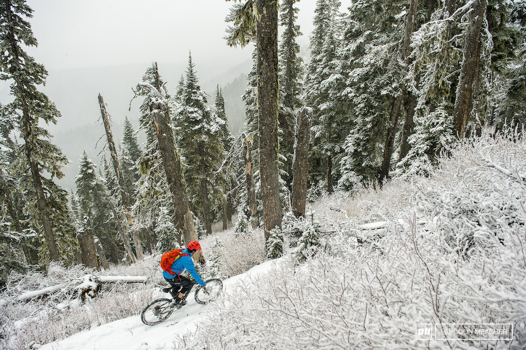Jameson taking the ridge out to drop into Ranger Creek for one last ride of the season... even if the snow wasn t going to close this trail down it gets the brunt of the winter storms meaning snapped tree tops littering the trail.