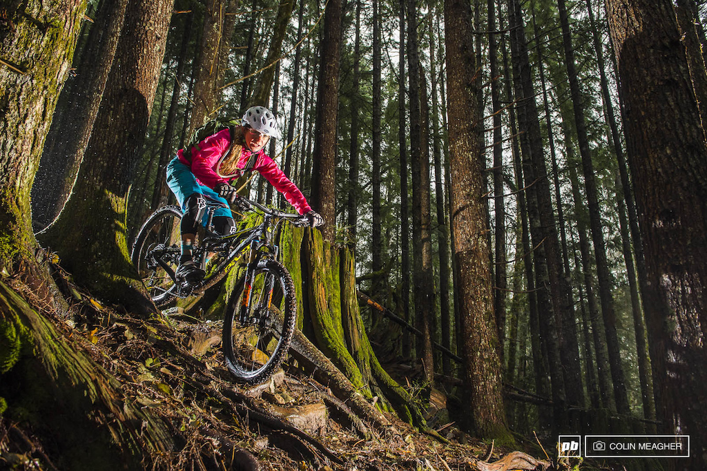 Jenny Konway skating across a root and rock laced line.