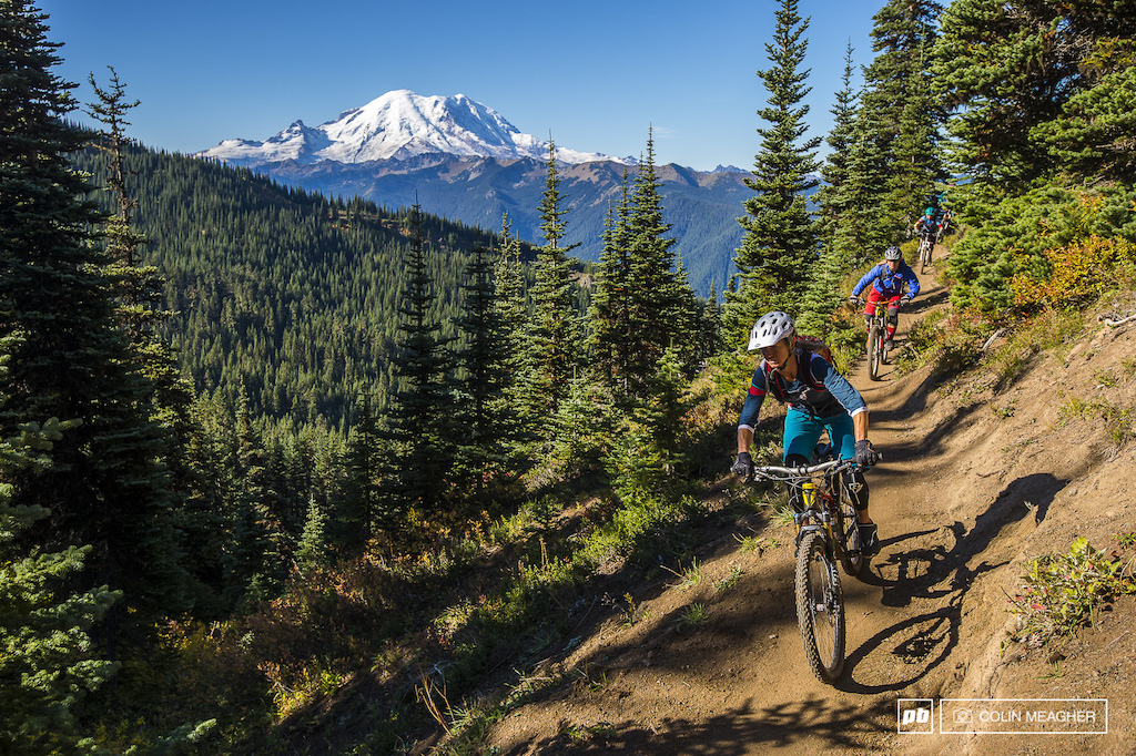 Mount Rainier is the dominant feature on the horizon of every ride on 410... It s simply impossible to ignore. Jenny Konway cruising towards Corral Pass with Nikki Hollatz and Kim Russell.