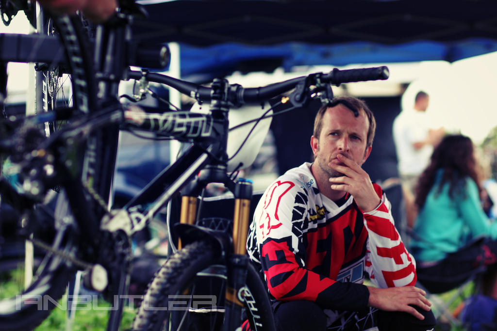 The British 4X Racing Series round 6 at pennance mill, Falmouth
 Photo: Rider Scott Beaumont with Fox head Europe, deep in thought while mechanics fine tune his Yeti cycle, all paid off as later he was crowned British 4X champion 2014.