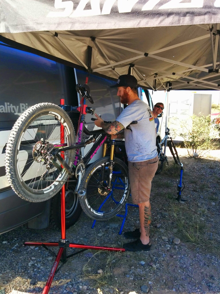 Michael from Arizona Bicycle Experts photo bombing the SC demo guy prepping the Bronson.