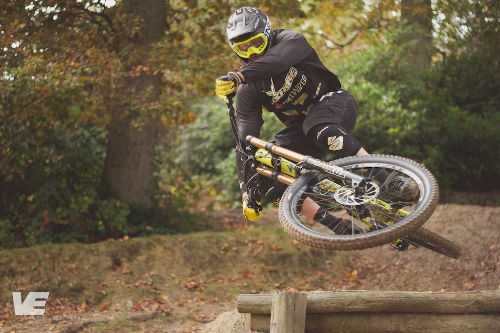 Zac laying the bike flat off a small road gap.