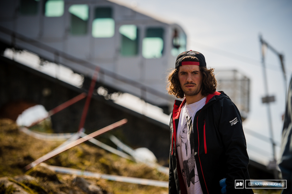 Sam Dale looking mean in front of the old school lift system. We're all hoping it has some powerful emergency brakes...