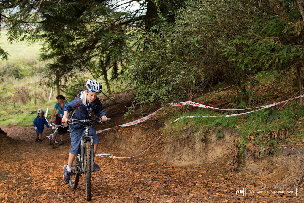 Pushing hard to reach the top of the course ahead of Zoe Gelatly.