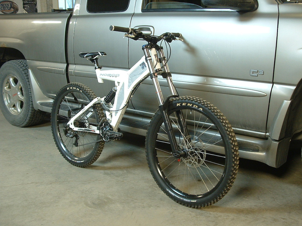 2001 Norco VPS Drop. Rockshox Revelation. Straightline direct mount stem. Raceface Diablous 31.8 bars. XT brake controls. Deore 2x9 shifters. Import lockon grips. Spreader bar end plugs. XTR front and rear brake calipers. Old style Saint 8" rotors, hubs, rear derailleur. XT front derailleur. Mavic EX729Disc 32 spoke rims (rear is D321 at the moment, waiting to repair 729 as the spokes are all wired and soldered), DT Swiss spokes, Kenda Nevegal JTS - 2.5 front 2.35 rear tires. Truvative Husselfelt crankset. Shimano chain gears. Shimano cassette and chain. Fox Vanilla. Wellgo V8 copy flat pedals. Hope brake caliper brackts. MEC seatpost with Norco clamp. Bontrager Evoke 3 saddle.