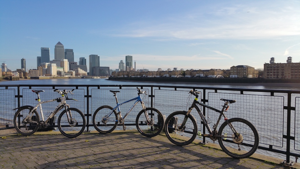 Trek 4500 X2 Gaint XTC after biking Harlow to London in front Canary Wharf