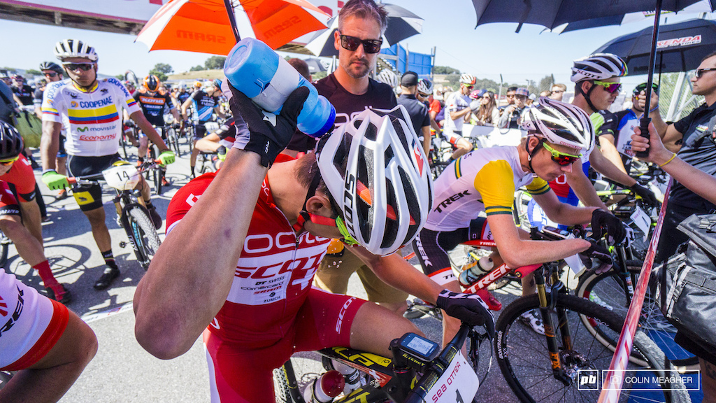 Schurter using every trick in the book to stay cool--dousing the back of his neck with ice cold water.
