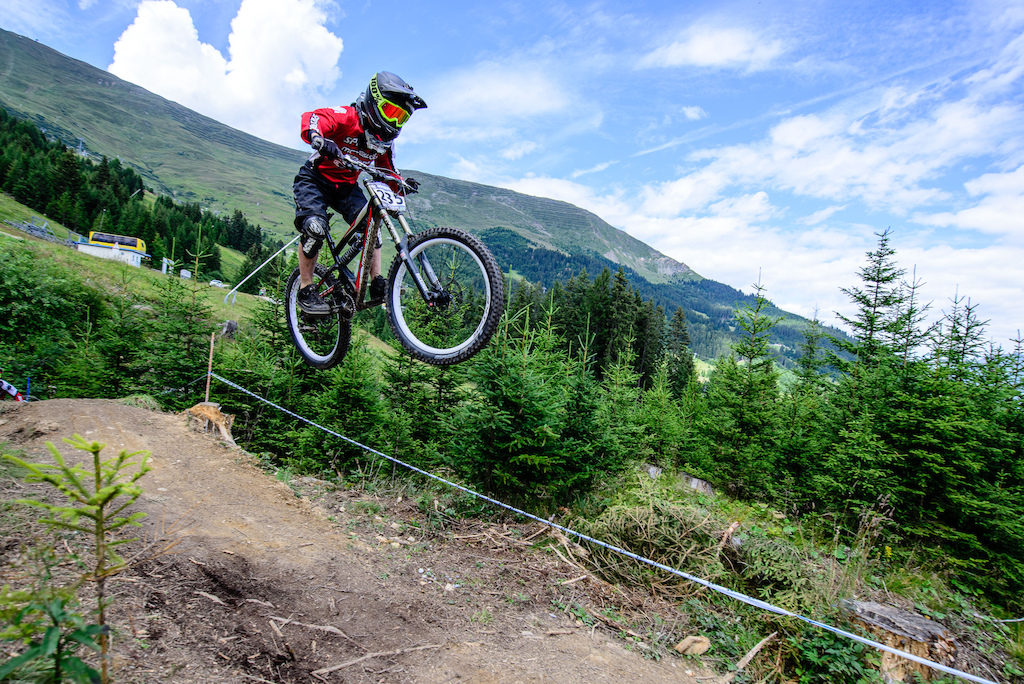 Moritz Ribarich of Austria races down the downhill track of the Bikepark Serfaus-Fiss-Ladis during the Kona MTB Festival Serfaus-Fiss-Ladis.ROOKIES in Tyrol, Austria, on August 8, 2014. Free image for editorial usage only: Photo by Felix Schüller