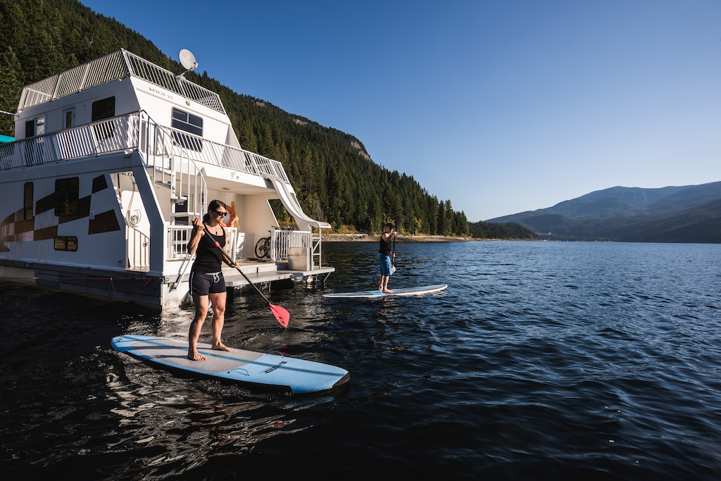 Photo by Dave Silver. Darren and Kelli of Endless Biking try paddle boarding after a long day of awesome riding
