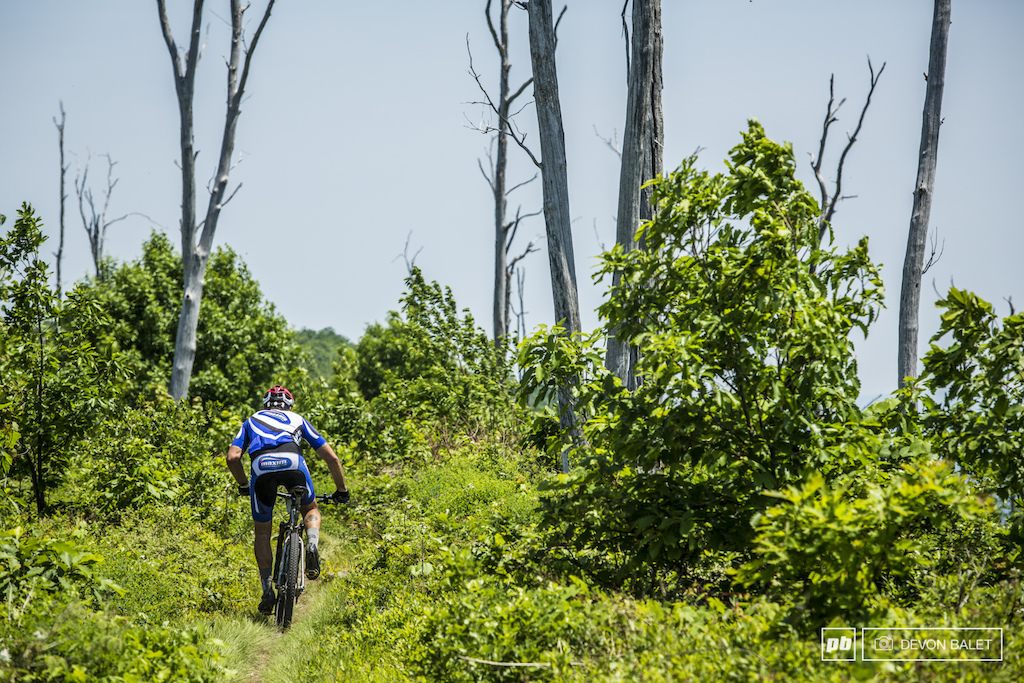 Dejay Birtch stands up and pedals out on the few smooth sections of Tussey Ridge. Birtch has spent the last two days chasing Jesse Quagliaroli.