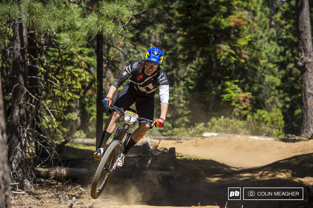 You can always tell the riders with DH experience when you see them in the air rather than looking for their landing they re already looking into the next corner. Curtis Keene looking deep into the berm he s about to touch down into.