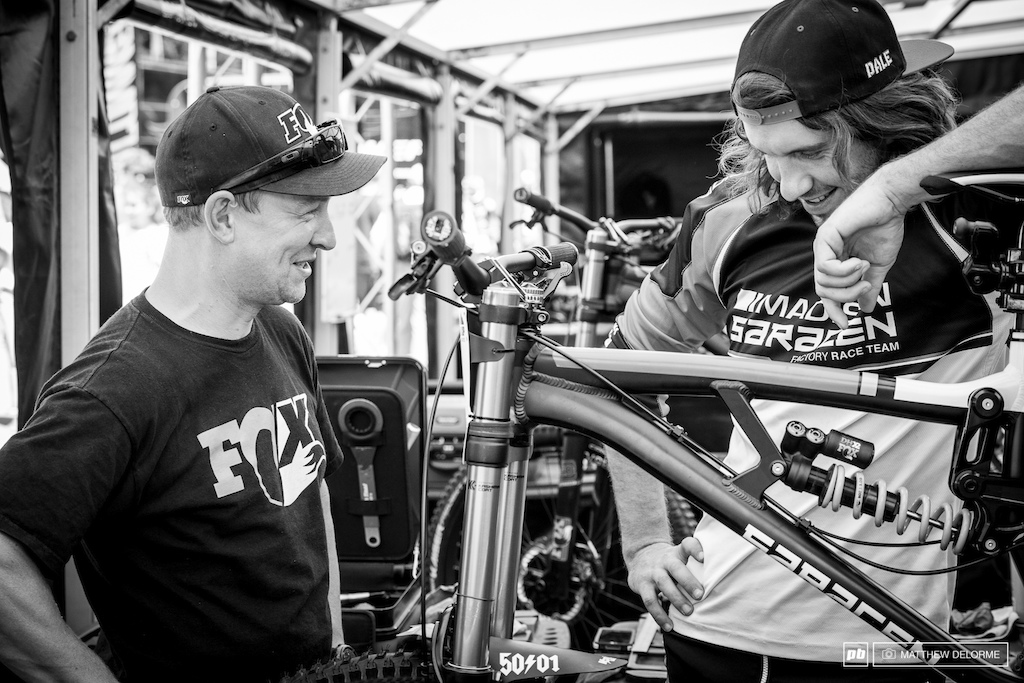 Sam Dale goes over his bike one last time with stand-in mechanic, James Richards, before heading up the gondola for his race run.