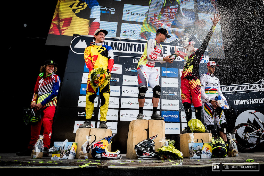 With a record breaking 18 World Cup wins and countless podium finishes Greg Minnaar knows the proper etiquette for welcoming a first timer onto the box. Drink up Dean Lucas