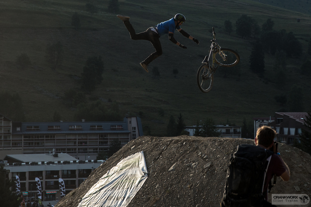 Sam Reynolds of Great Britain loses his grip in mid air above the Slopestyle course at Crankworx Les Deux Alpes in France(Photo by clint trahan/crankworx)