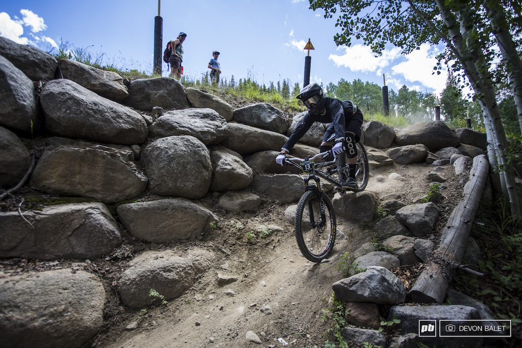 This relatively mellow looking section took down several riders over the weekend. A hidden pedal grabber at the top of the rocks sent a few racers for a ride. Roy Benge demonstrates a clean ride through.