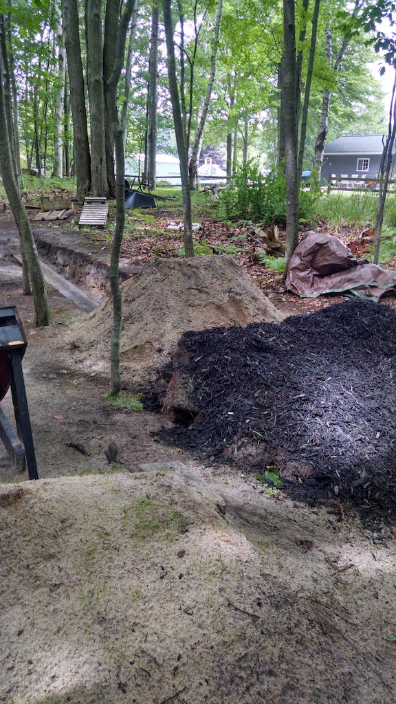 My New mulch jump. From the run in to the lip, its about 5 foot high and from the ground to the lip its about 3.