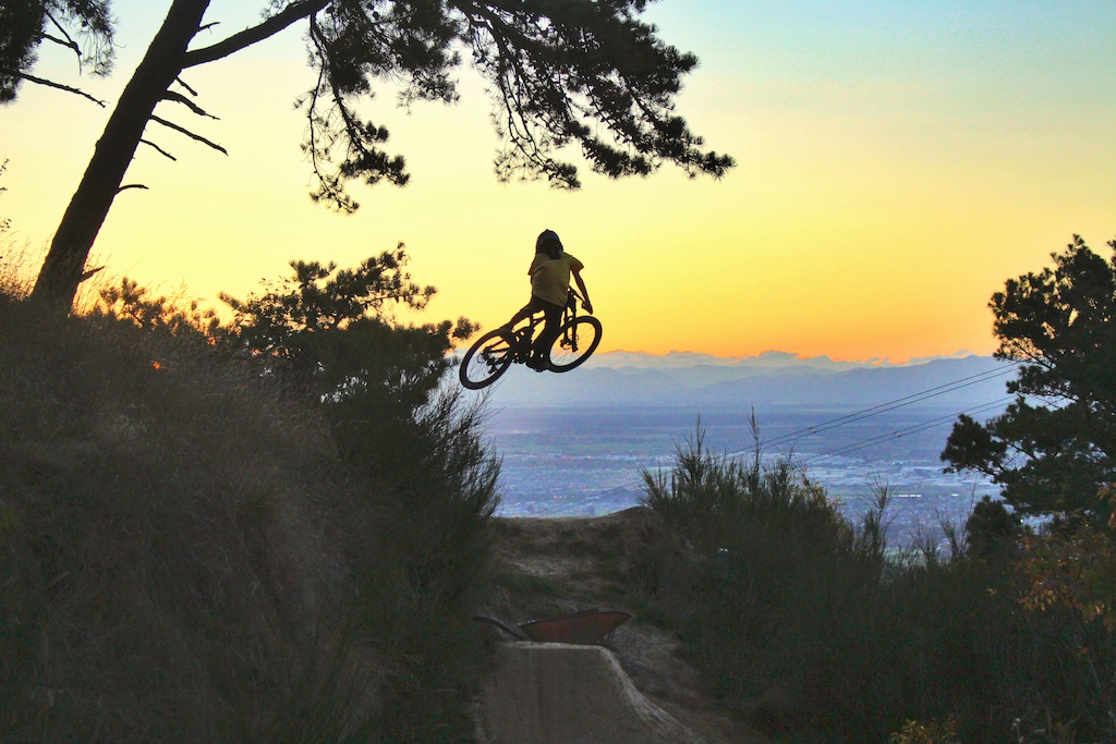 Hunter Paull (age 13) jumping into the evening sunset on the popNfresh step up. Photo taken by Finn Hawkesby-brown(age 12)