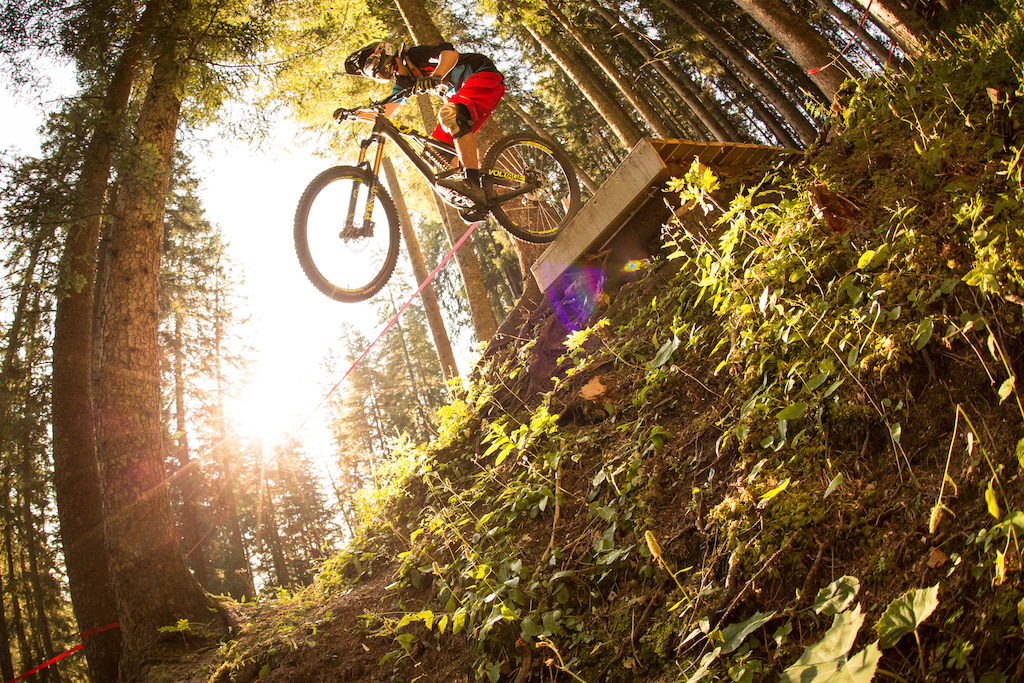 Fabian dropping into a steep section on the new downhill track in the Bikepark Brandnertal, Austria.