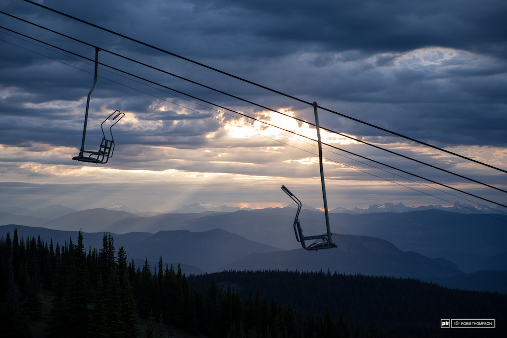 Light finds it's way thourgh the clouds to slowly wake up the resort, the Monashee Mountians in the background.