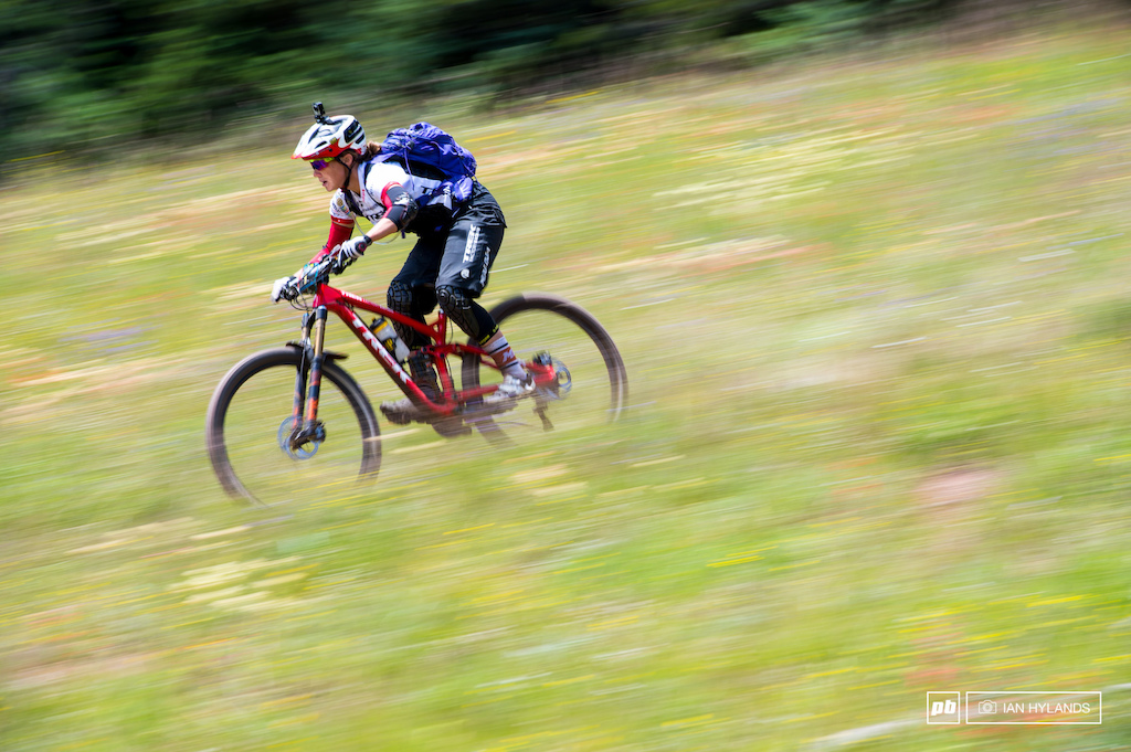 Tracy Moseley ripping through a meadow full of wildflowers.