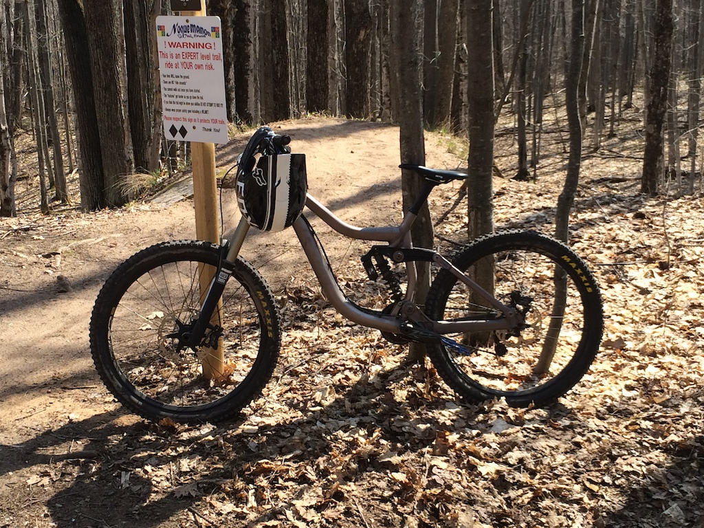 one of the first free ride days in very early spring in Marquette.  This is a big 20 foot step down road gap over a boulder.  total drop is maybe 15 feet down.