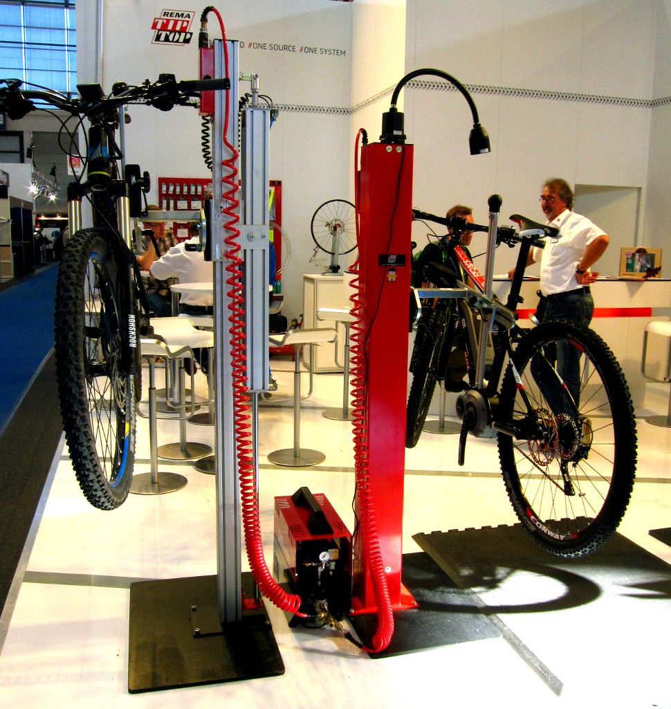 Rema Tip Top's pneumatic bicycle lift is available in three models starting at 1500 Euro, with the top-of-the-line lift on the left selling for around 2600 Euros. 

Eurobike 2015