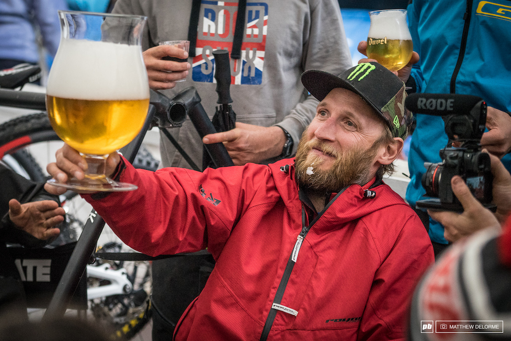 Peaty raises a mighty beer. The Syndicate had an impromptu after party int he pits when the rains washed out practice.