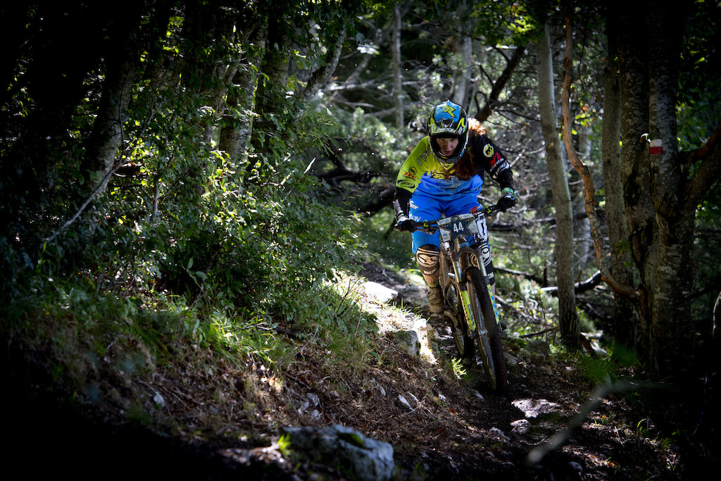 Winner Raphaela Richter from Germany races down stage 5 during the 4th stop of the European Enduro Series at Molveno-Paganella, Italy on September 06, 2015. Free image for editorial usage only:Photo by Manfred Stromberg
