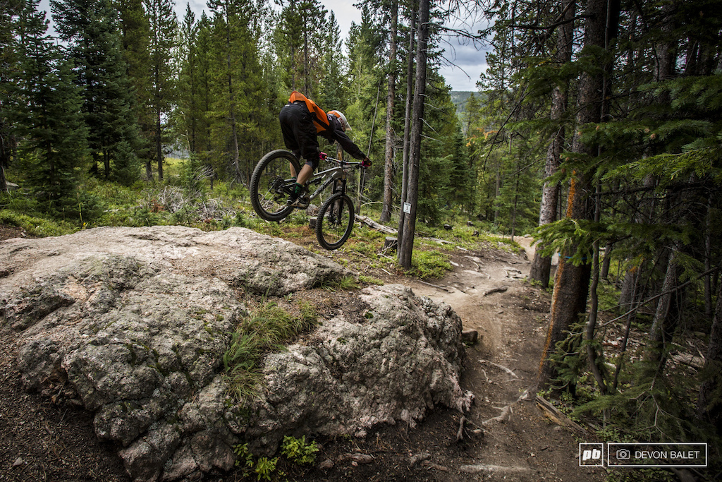 Trestle Bike Park isn t all smooth fast bermed trails. There are a few rocks to be found as well. Scott Countryman goes low and fast over one particularly large rock.