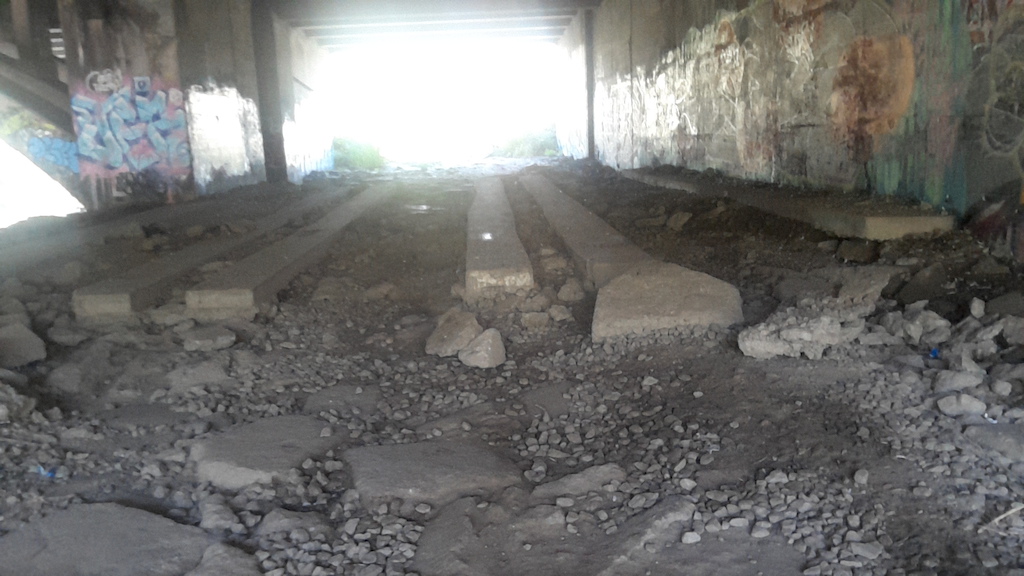Under the QEW. Cement skinnies and loose rocks.