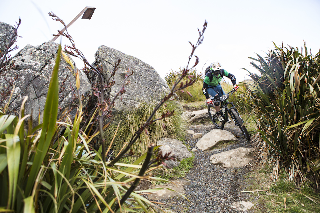 A rider negotiates the rocks during the 2015 Urge 3 Peaks Enduro mountain biking race held in Dunedin, New Zealand.