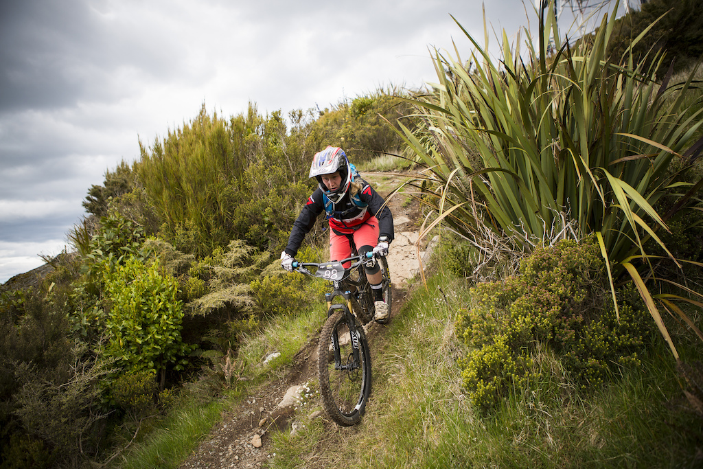 Whitney Dagg, of Wanaka, drops into the trail on Mt Cargill during the 2015 Urge 3 Peaks Enduro mountain biking race held in Dunedin, New Zealand.