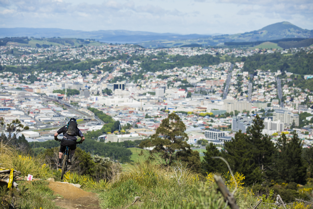 A rider drops in toward the city of Dunedin during Day 2 of the 2015 Urge 3 Peaks Enduro mountain biking race held in Dunedin, New Zealand. November 29, 2015.
