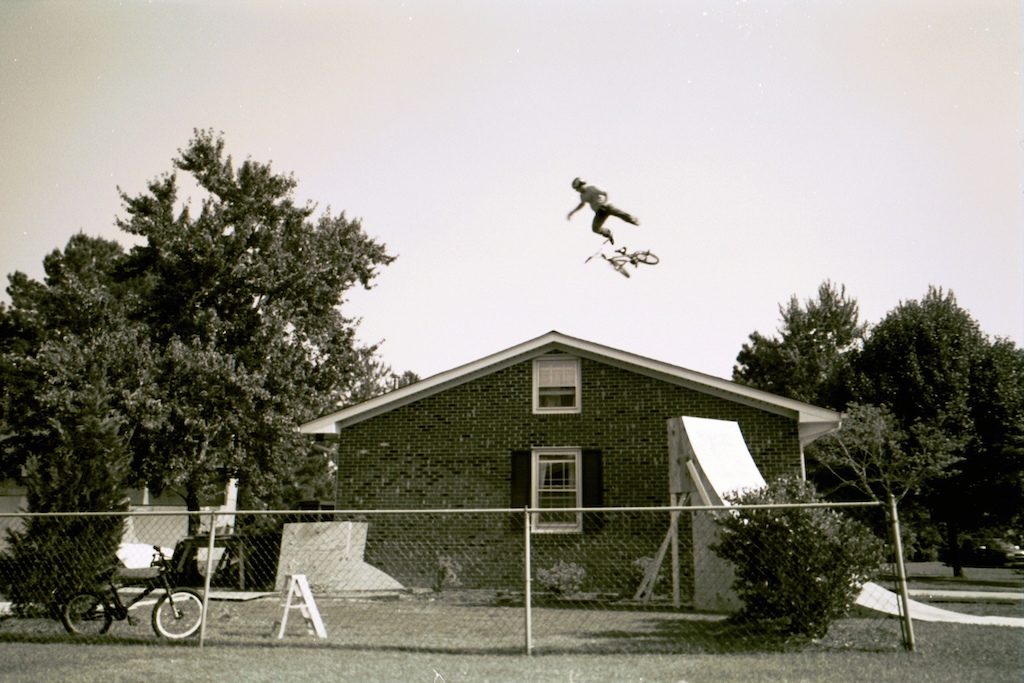 On a hot hot day in North Carolina Allan repeatedly pedaled into this monster jump over his house. After a few scary bails he landed his 360 whip. Camera Kodak disposable Film Kodak B amp W 400 Edit unretouched